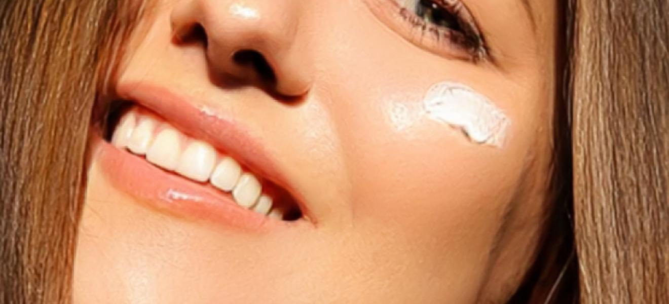 picture of a woman with suncream on her face