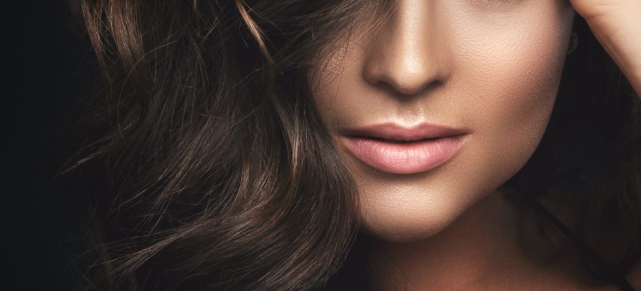 picture of a glamorous women with dark hair and makeup