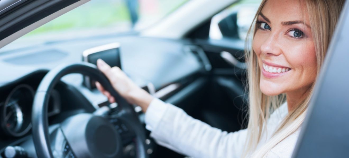 picture of a mum with natural make up in a car on the school run