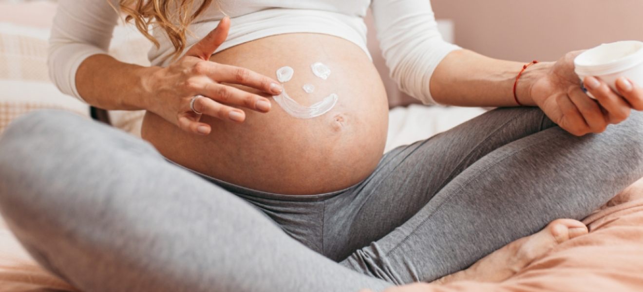 picture of a pregnant woman following a winter skincare routine