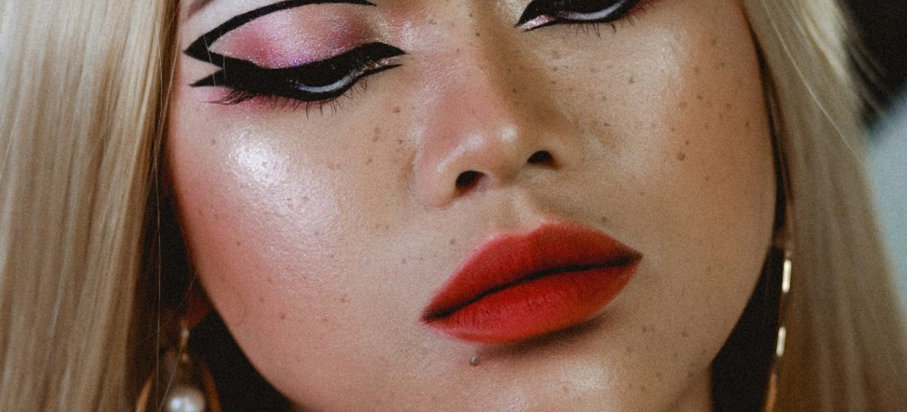 picture of a woman trying out the graphic eyeliner trend