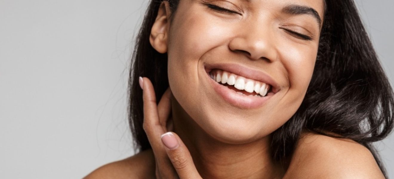 a girl sming with great skin picture of a girl smiling with great skin