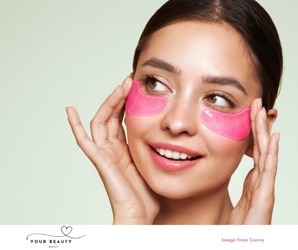 picture of a woman with pink gel eye masks on to help reduce the appearance of puffy eyes