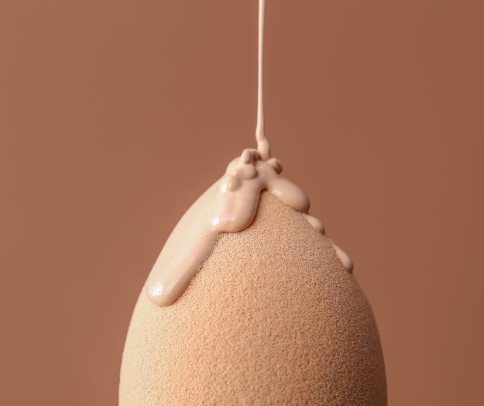 picture of foundation or bb cream being poured onto a makeup sponge