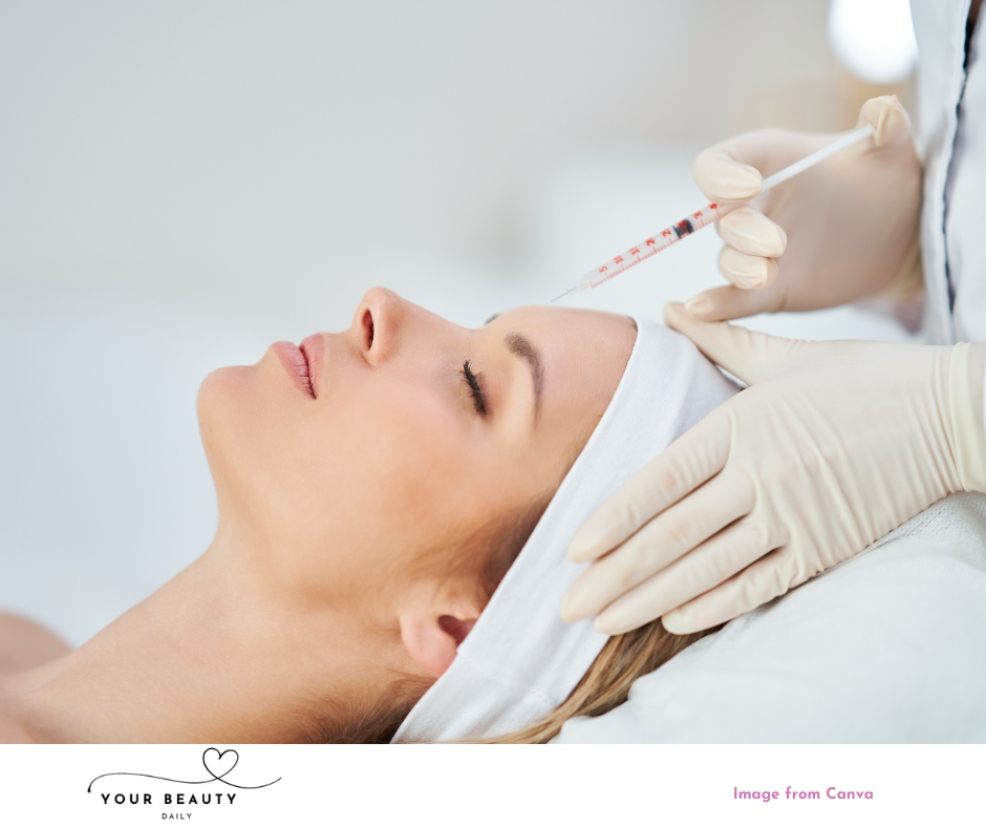 picture of a woman laying down with her eyes closed having a botox injection in her forehead