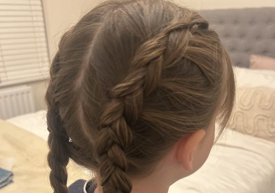 picture of a tween girl with a dutch braid plait perfect for school or sports