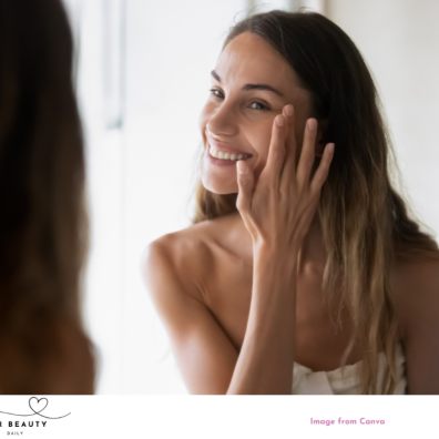 a beautiful woman looking at her natural healthy skin in the mirror picture of a beautiful woman looking at her natural healthy skin in the mirror